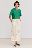 T-Shirt Cropped em Couro

Saia em Jacquard com Textura Enrugada Bordada