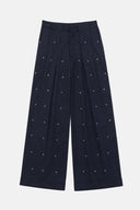 Calça com Poás Metalizados